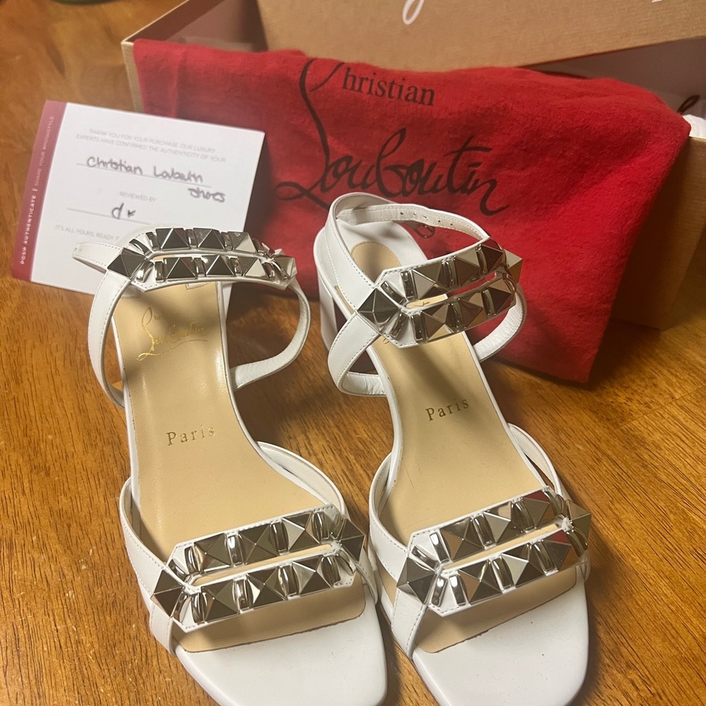 Christian LouBoutin white strapped heels.  Very sexy!